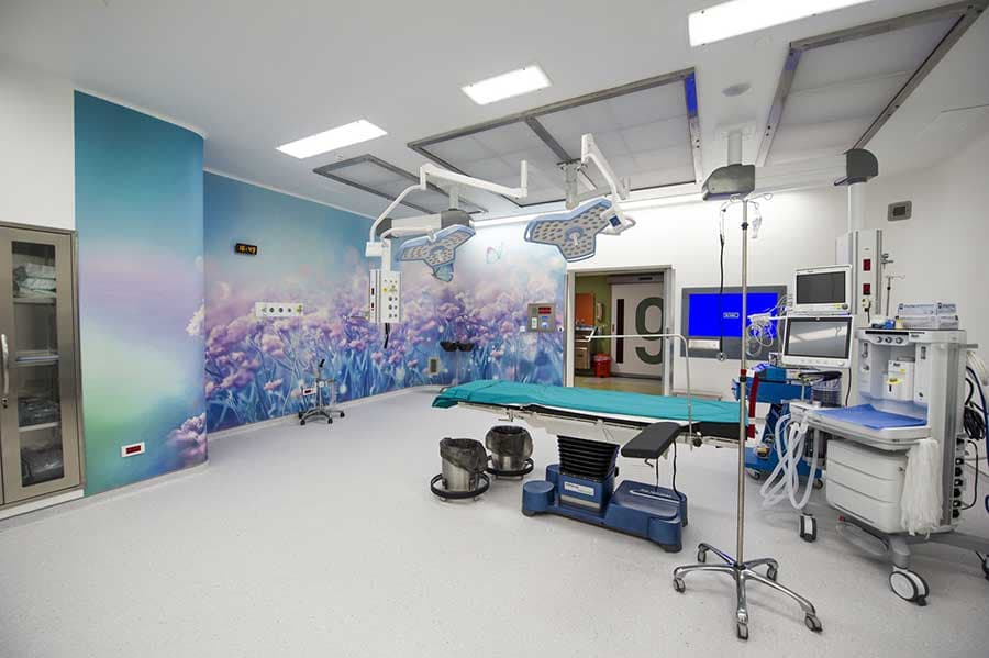 Operating room with full surgical setup and LED lights