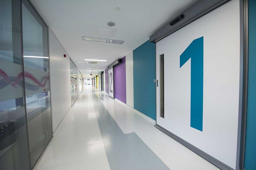 Surgical floor corridor with numbered operating rooms